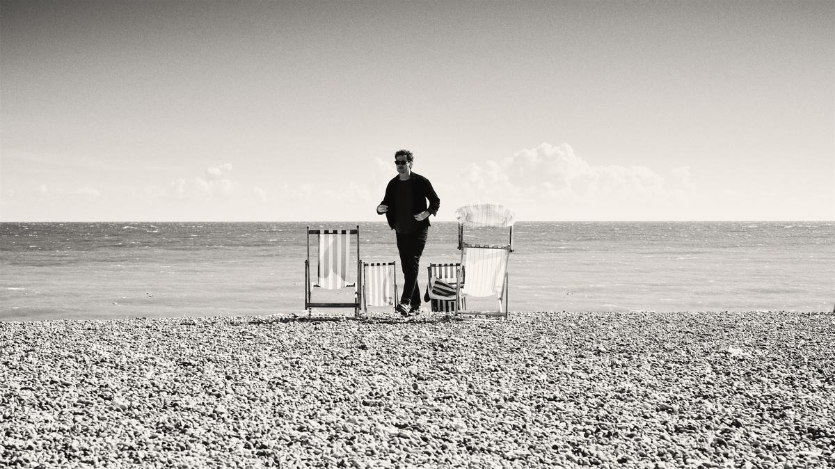 Man between chairs.jpg