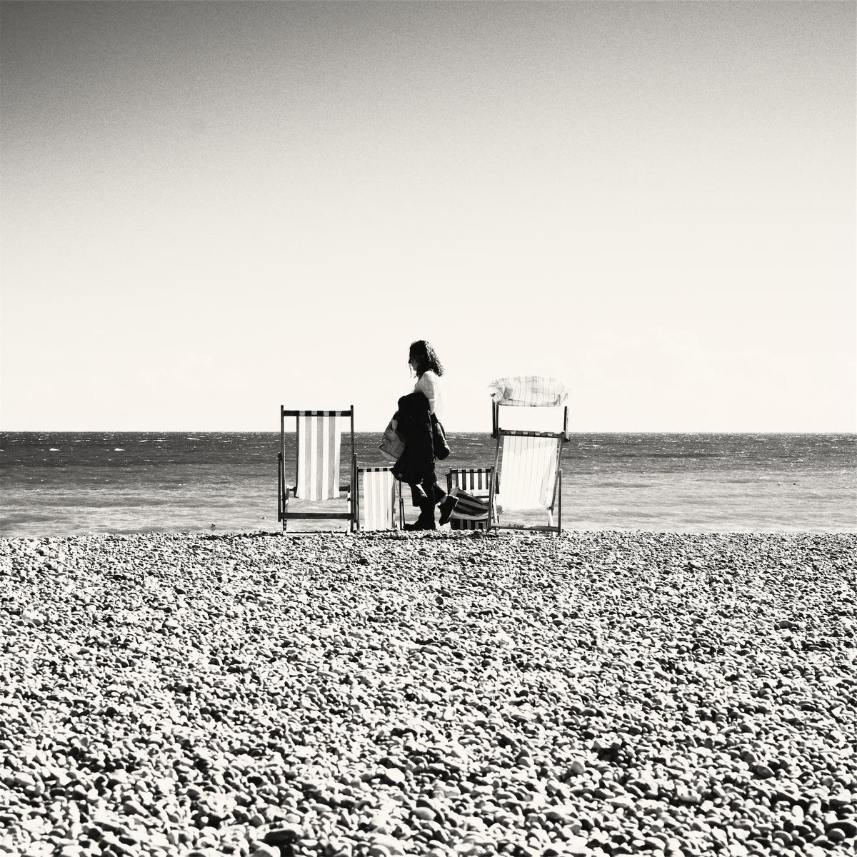 Woman between chairs square.jpg