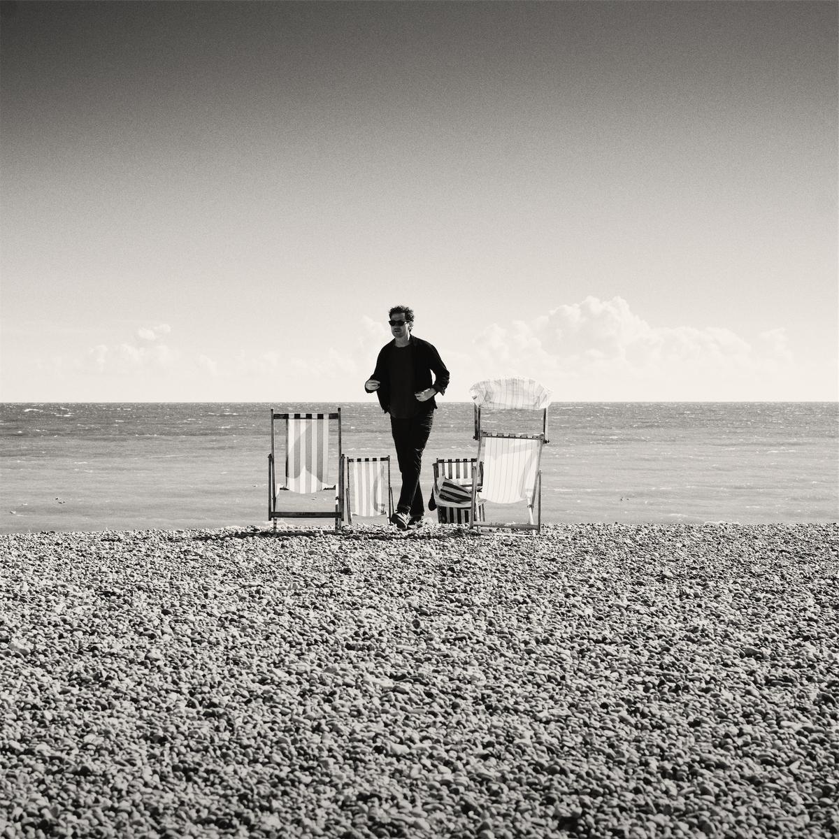 Man between chairs square.jpg